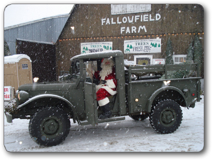 Photo of Santa arriving at Fallowfield Christmas Tree Farm in an old jeepy truck
